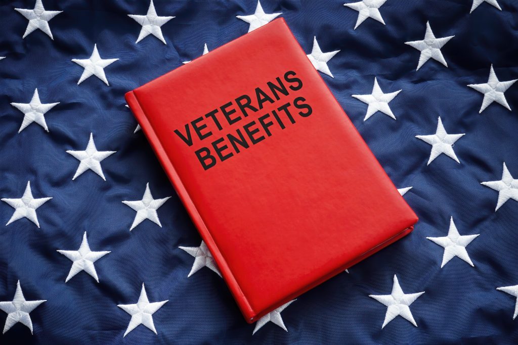 Book veterans benefits on a big flag.
